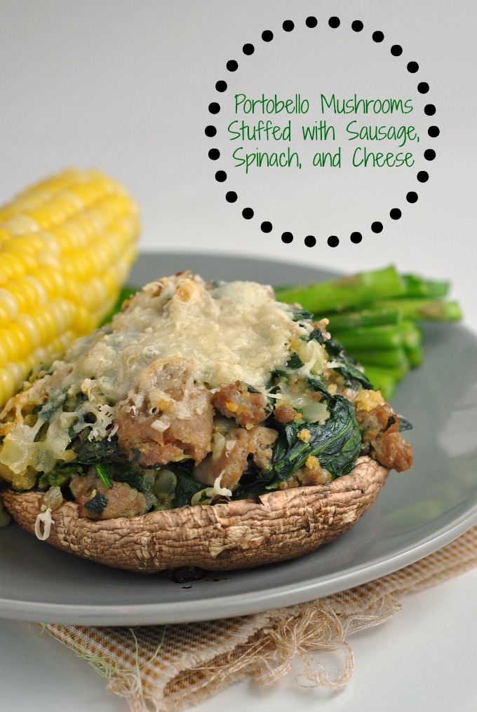 Cheesy stuffed mushroom on a plate with corn and asparagus, and a checkered linnen napkin. 
