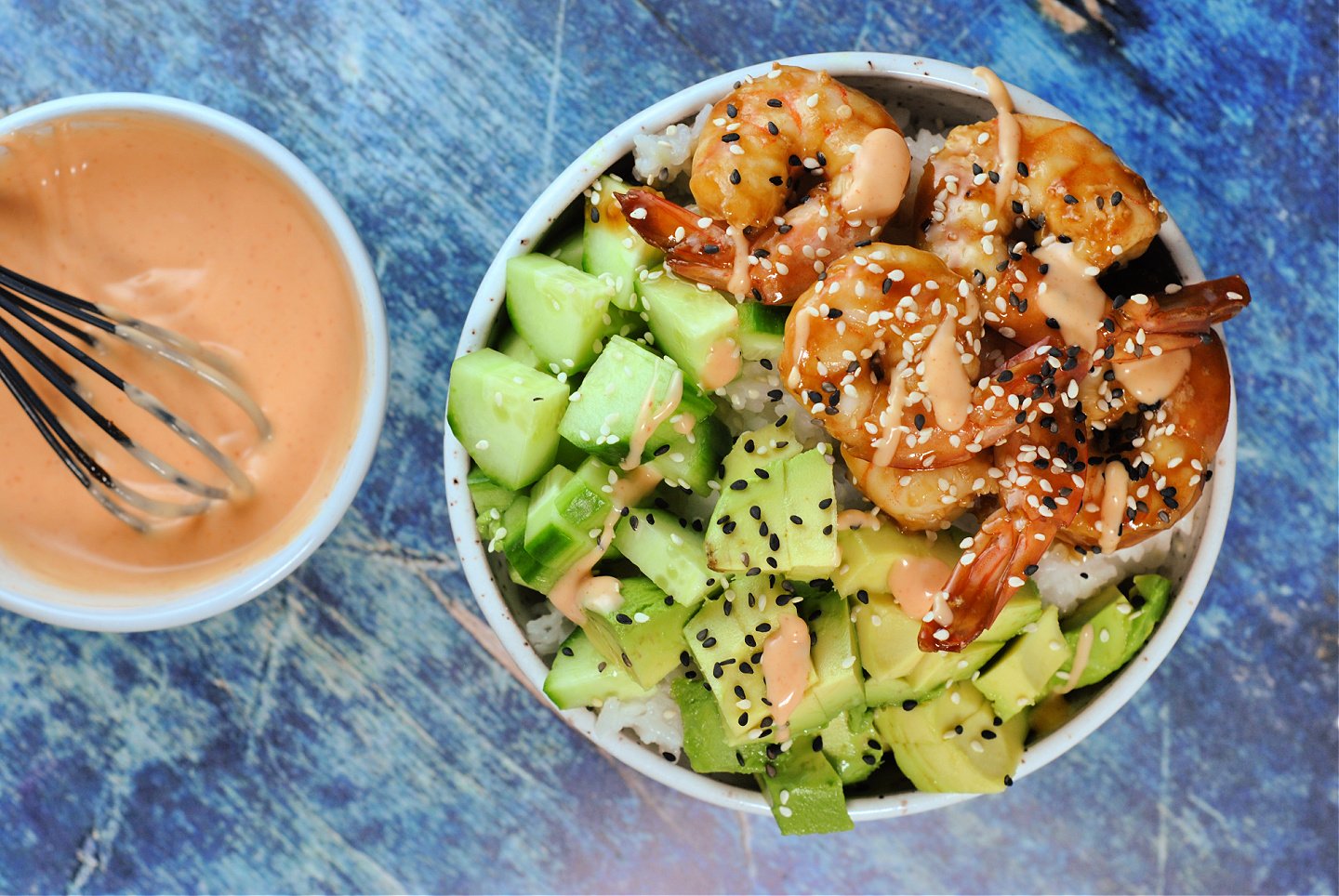 Shrimp rice bowl with freshly whisked bowl of sriracha mayo. 
