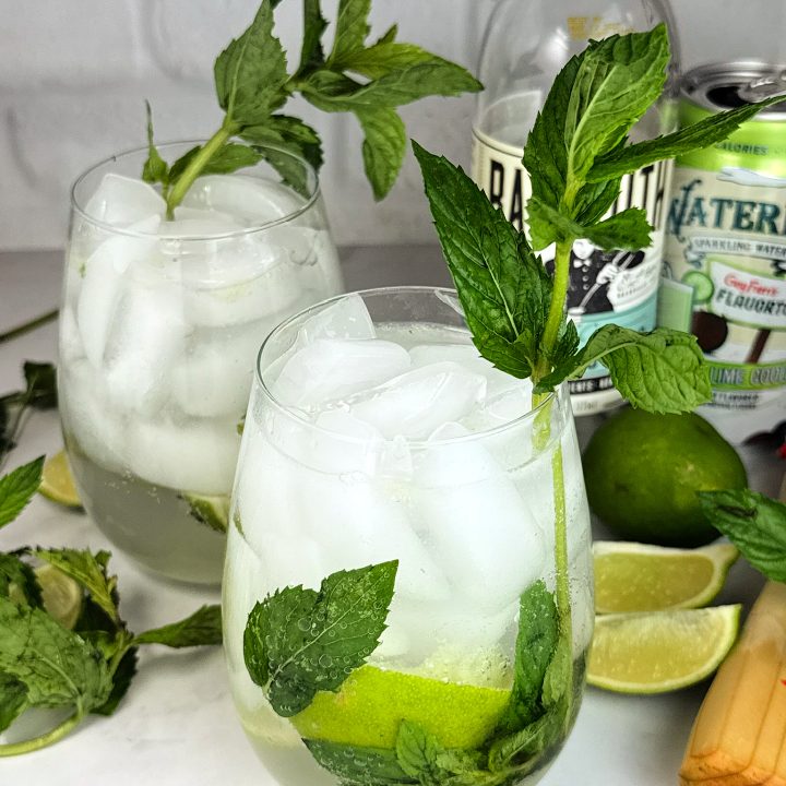 Faux-Jito Mojito mocktail made with fresh lime, mint, ice, and sparkling coconut-lime water in two glasses